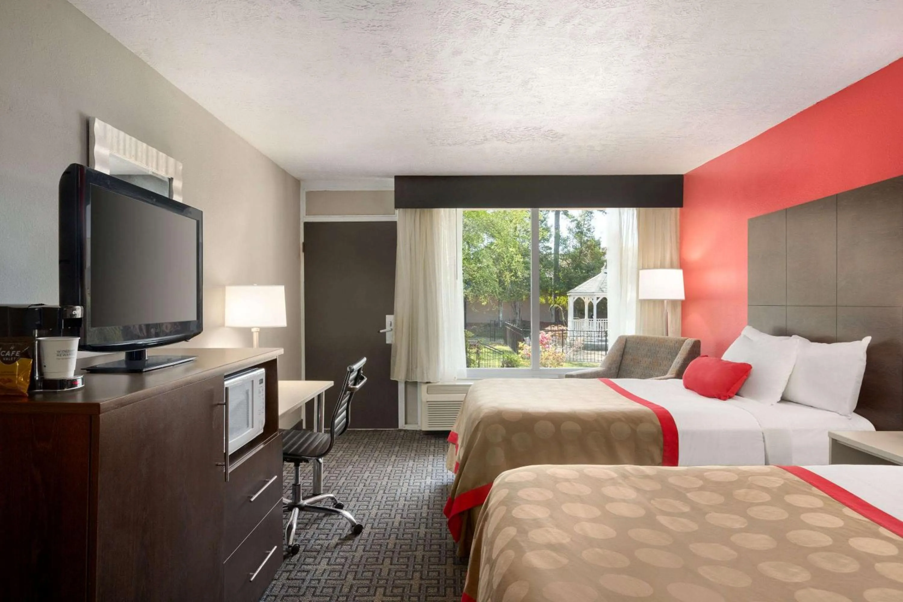 Photo of the whole room, TV/Entertainment Center in Ramada by Wyndham Augusta Fort Gordon