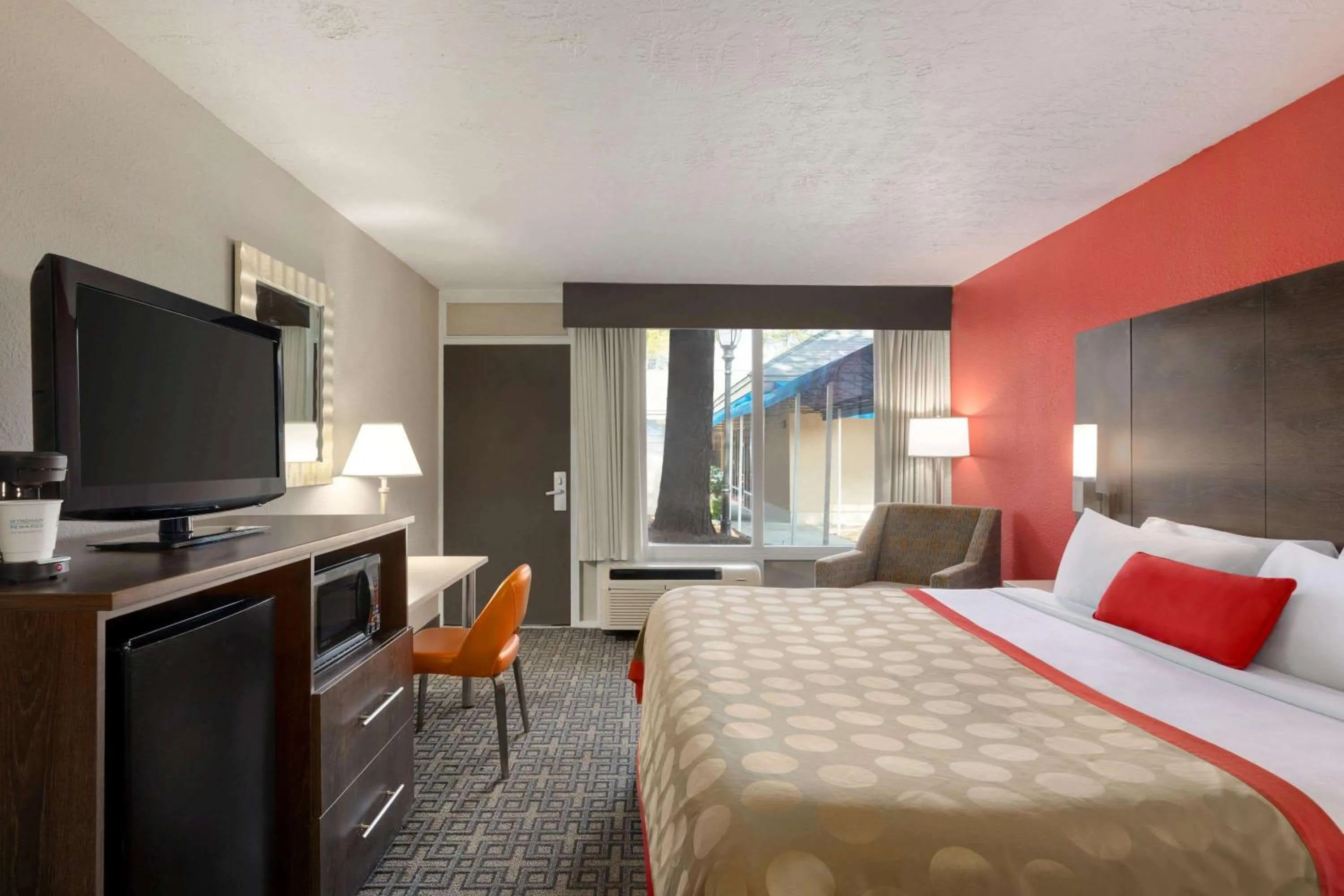 Photo of the whole room, TV/Entertainment Center in Ramada by Wyndham Augusta Fort Gordon