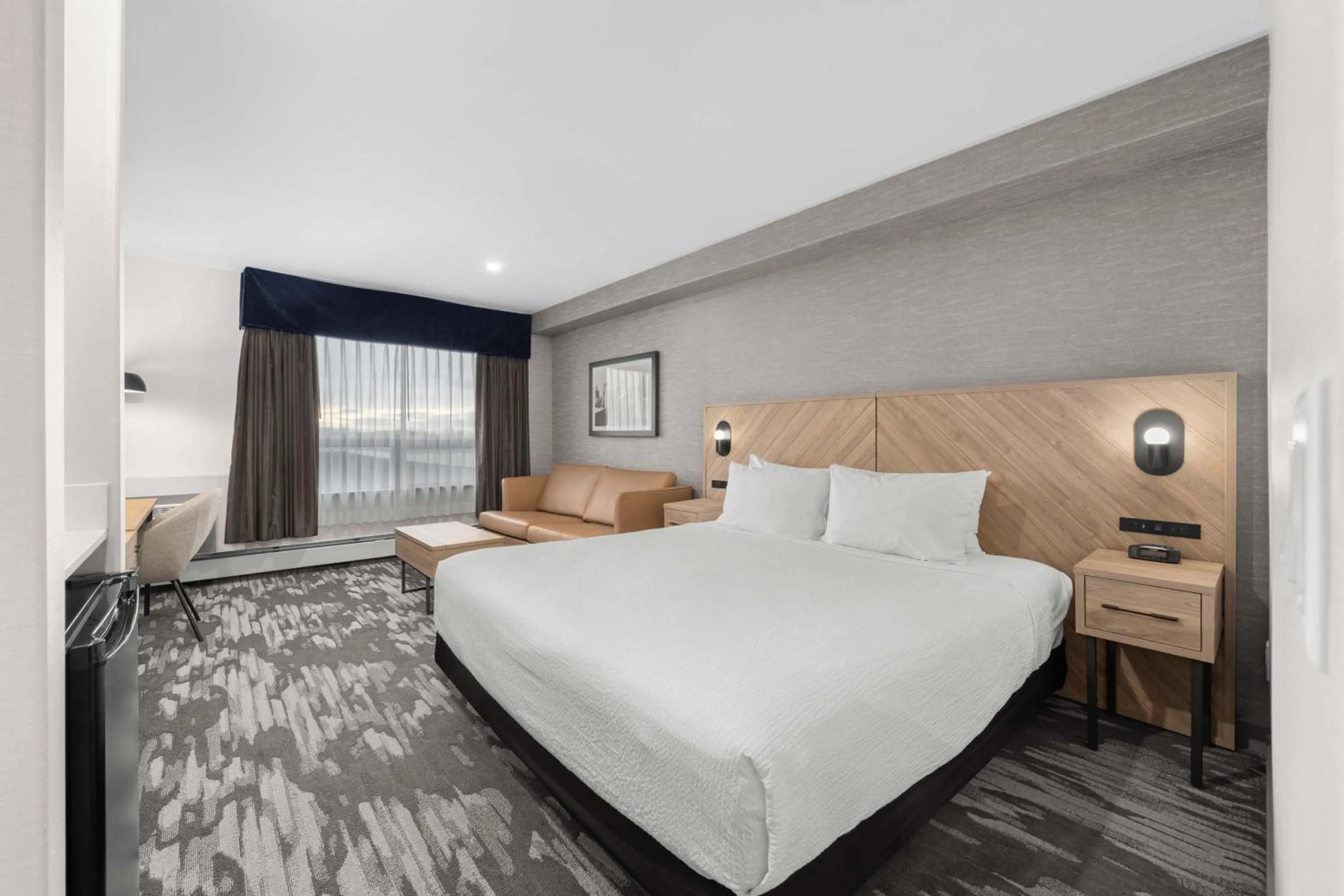 Photo of the whole room, Bed in Sandman Hotel Calgary Airport