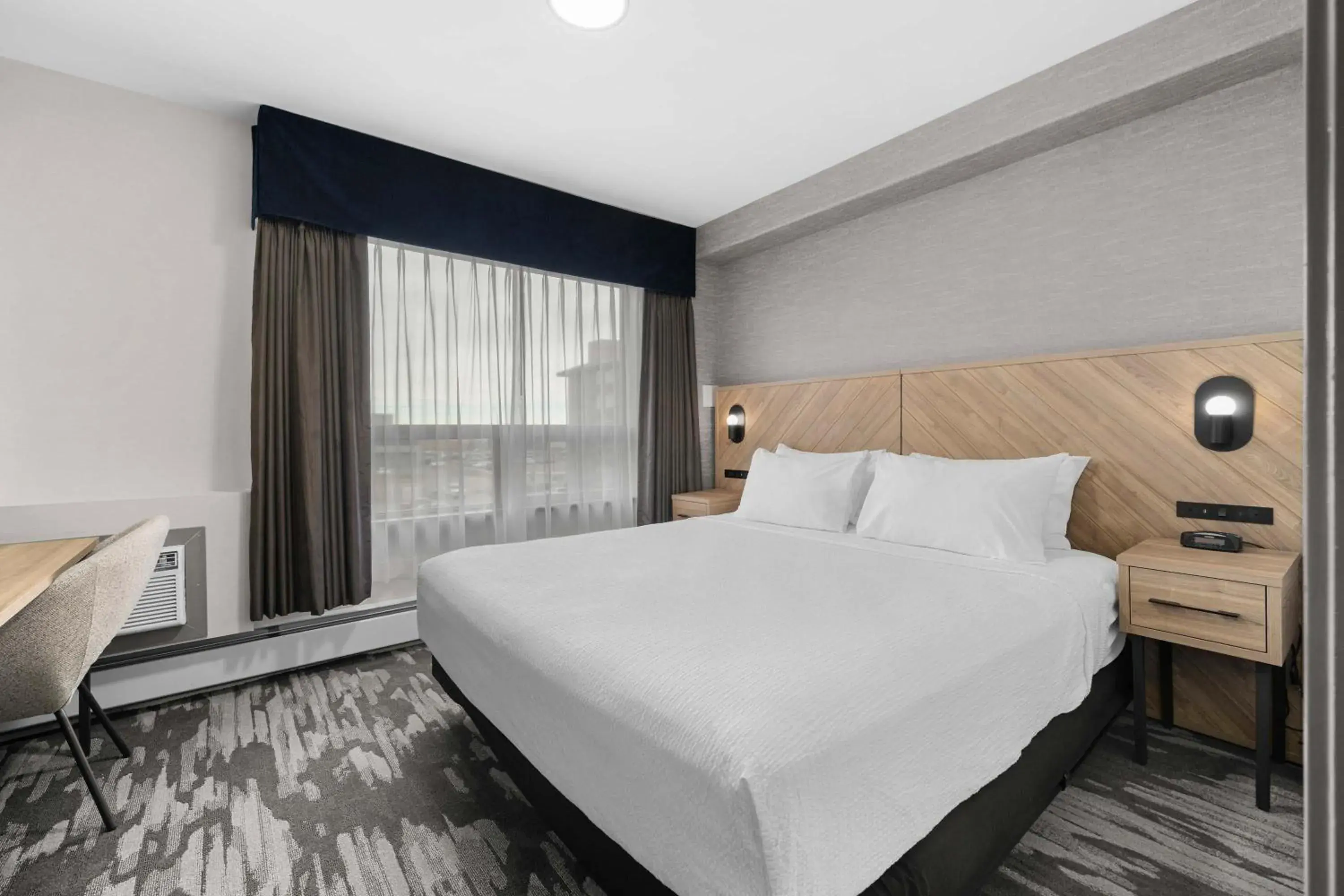 Photo of the whole room, Bed in Sandman Hotel Calgary Airport Photo of the whole room, Bed in Sandman Hotel Calgary Airport