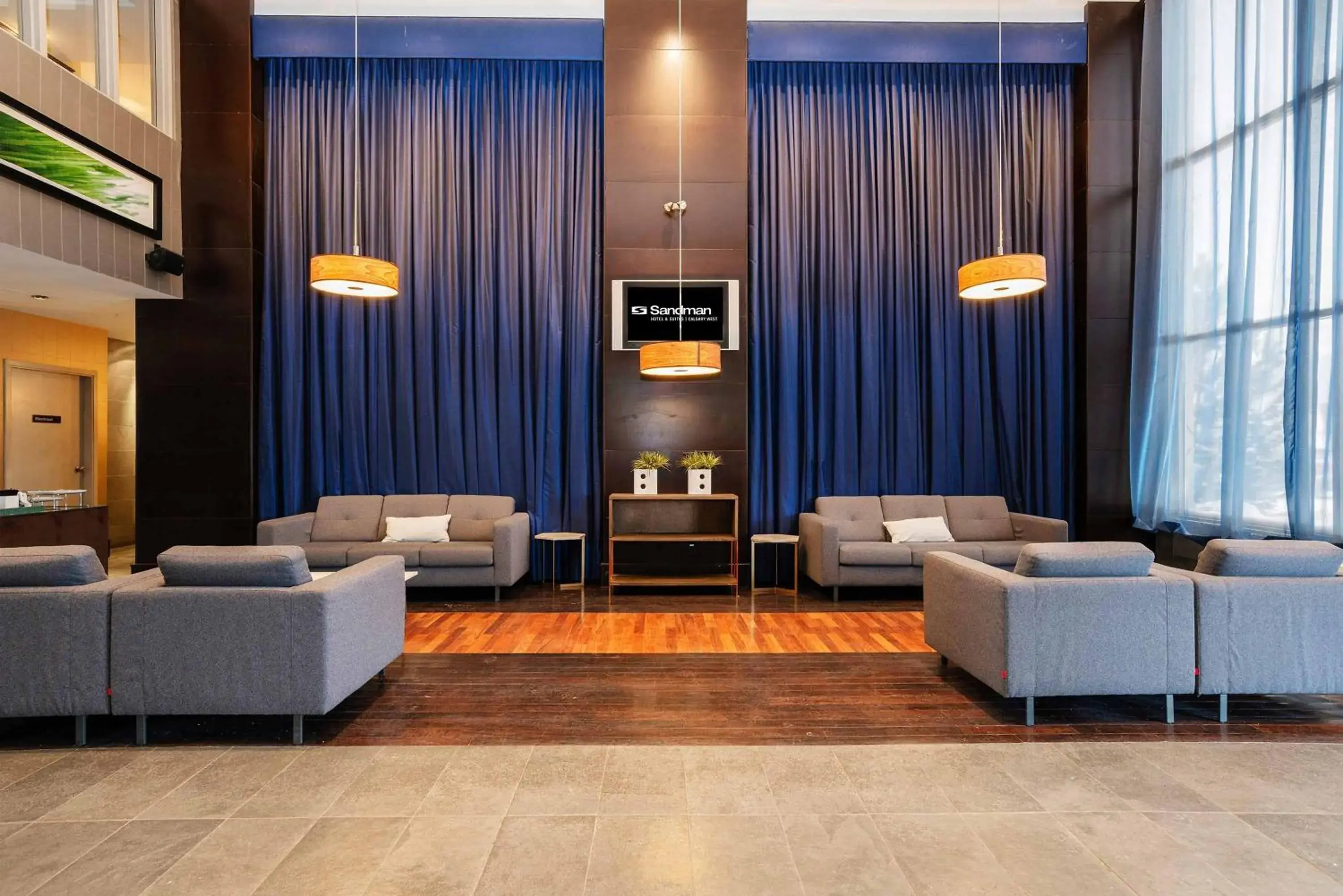 Lobby or reception in Sandman Hotel & Suites Calgary West Lobby or reception in Sandman Hotel & Suites Calgary West