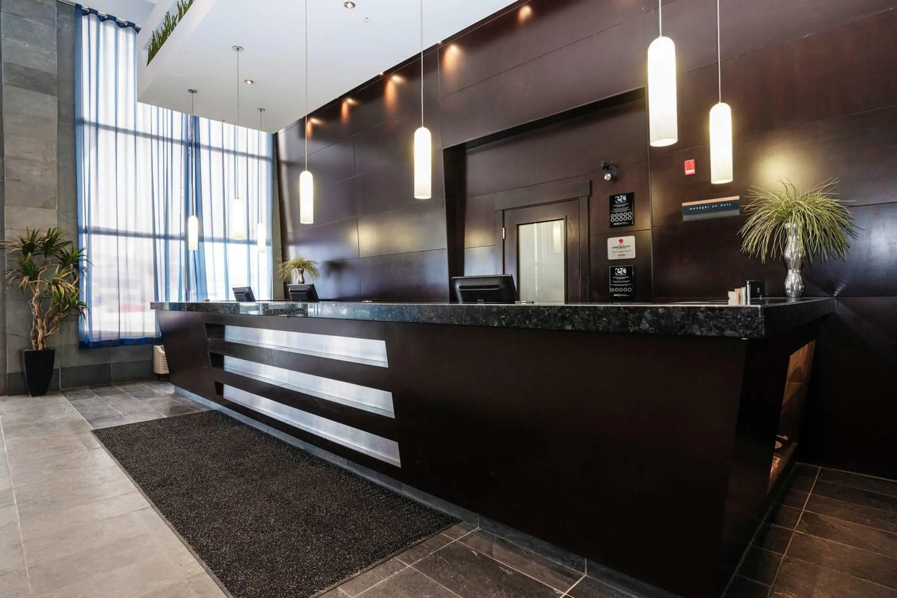 Lobby or reception in Sandman Hotel & Suites Calgary West Lobby or reception in Sandman Hotel & Suites Calgary West