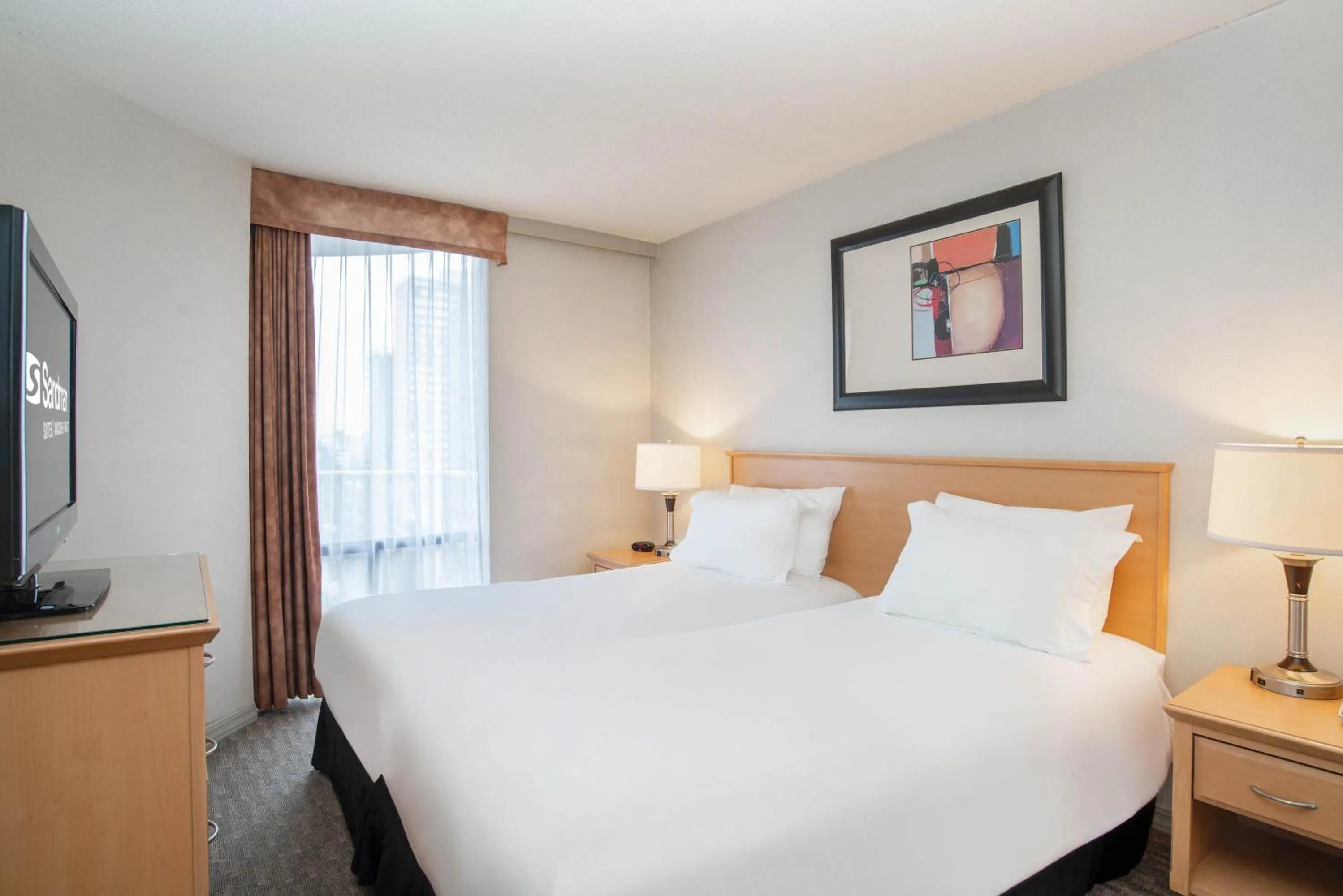 Photo of the whole room, Bed in Sandman Suites Vancouver on Davie