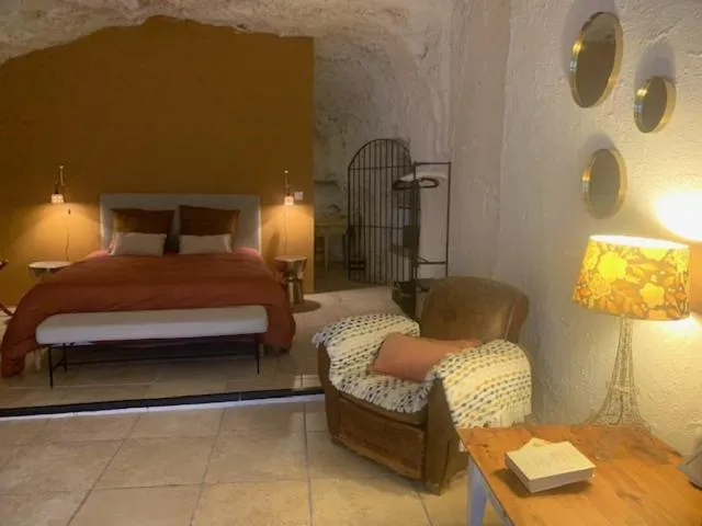 Bed in Les Troglos de la Tufolière