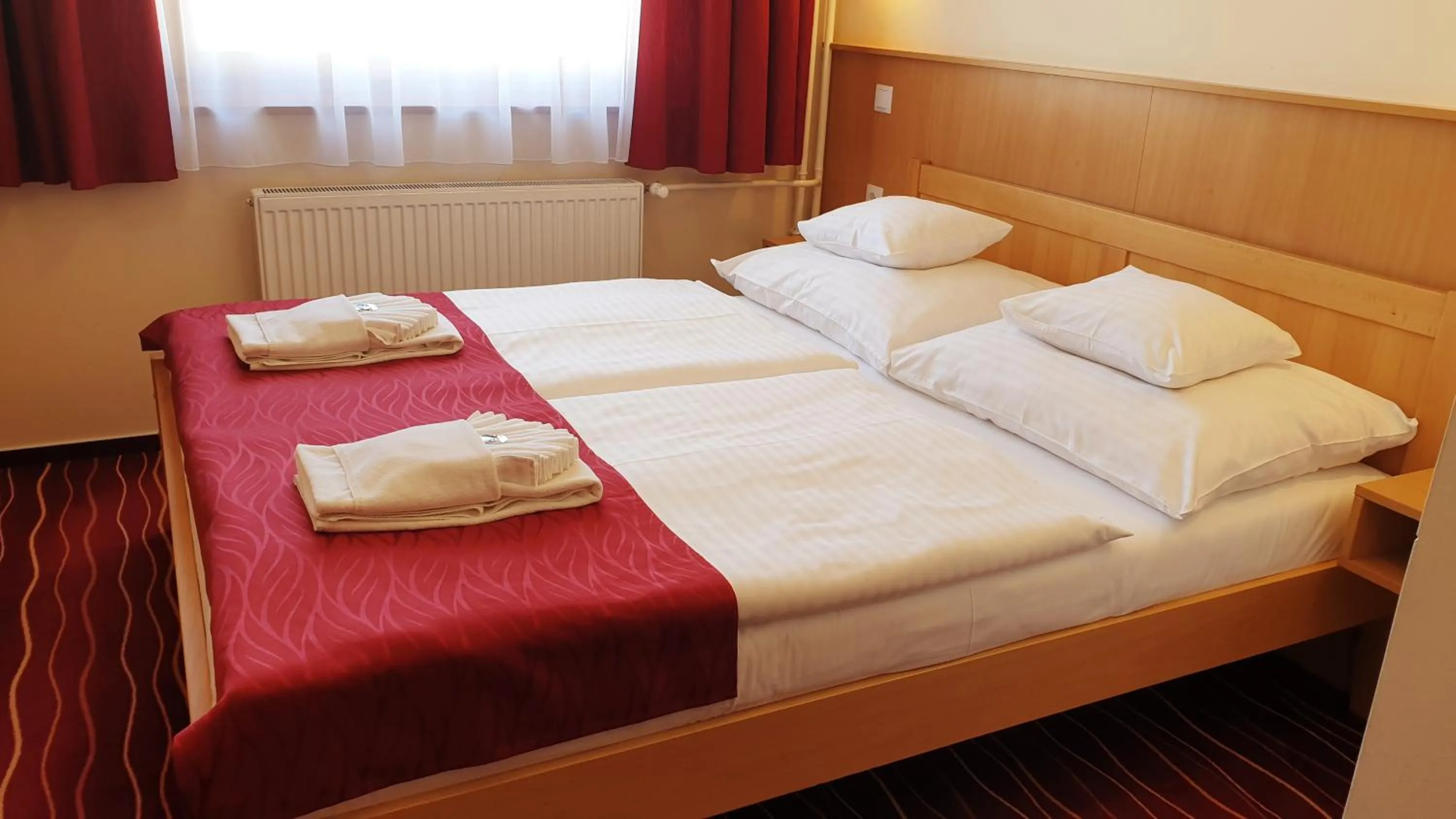 Bed in Diana Club Hotel