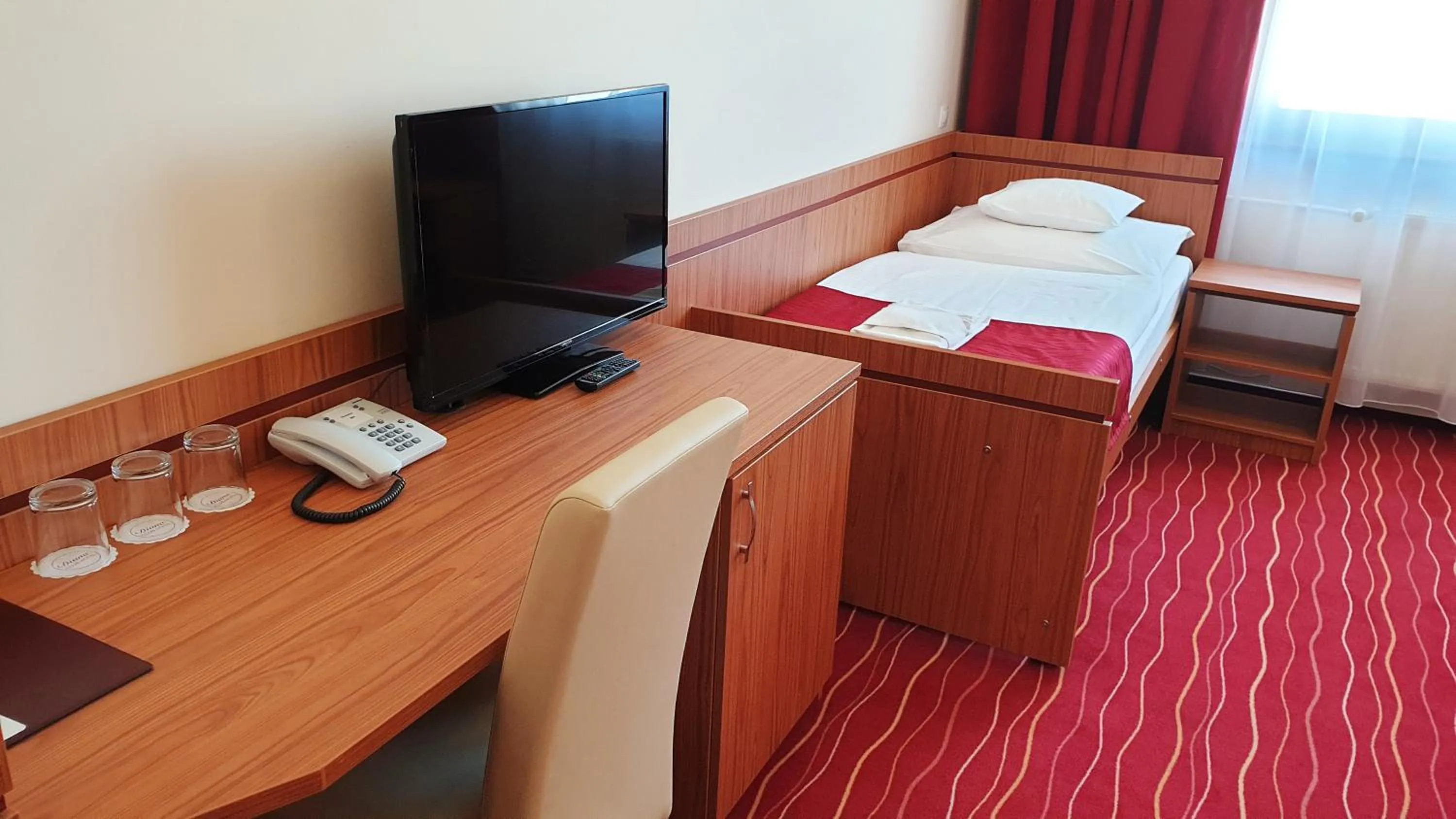 Bed in Diana Club Hotel