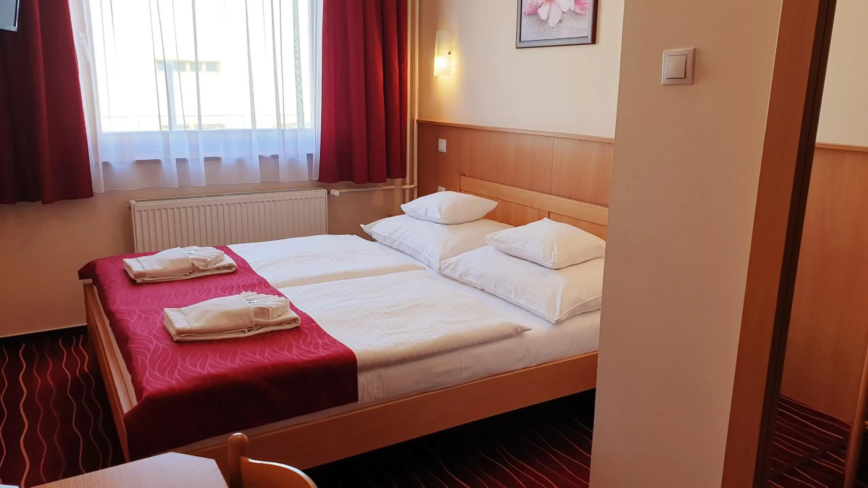 Bed in Diana Club Hotel