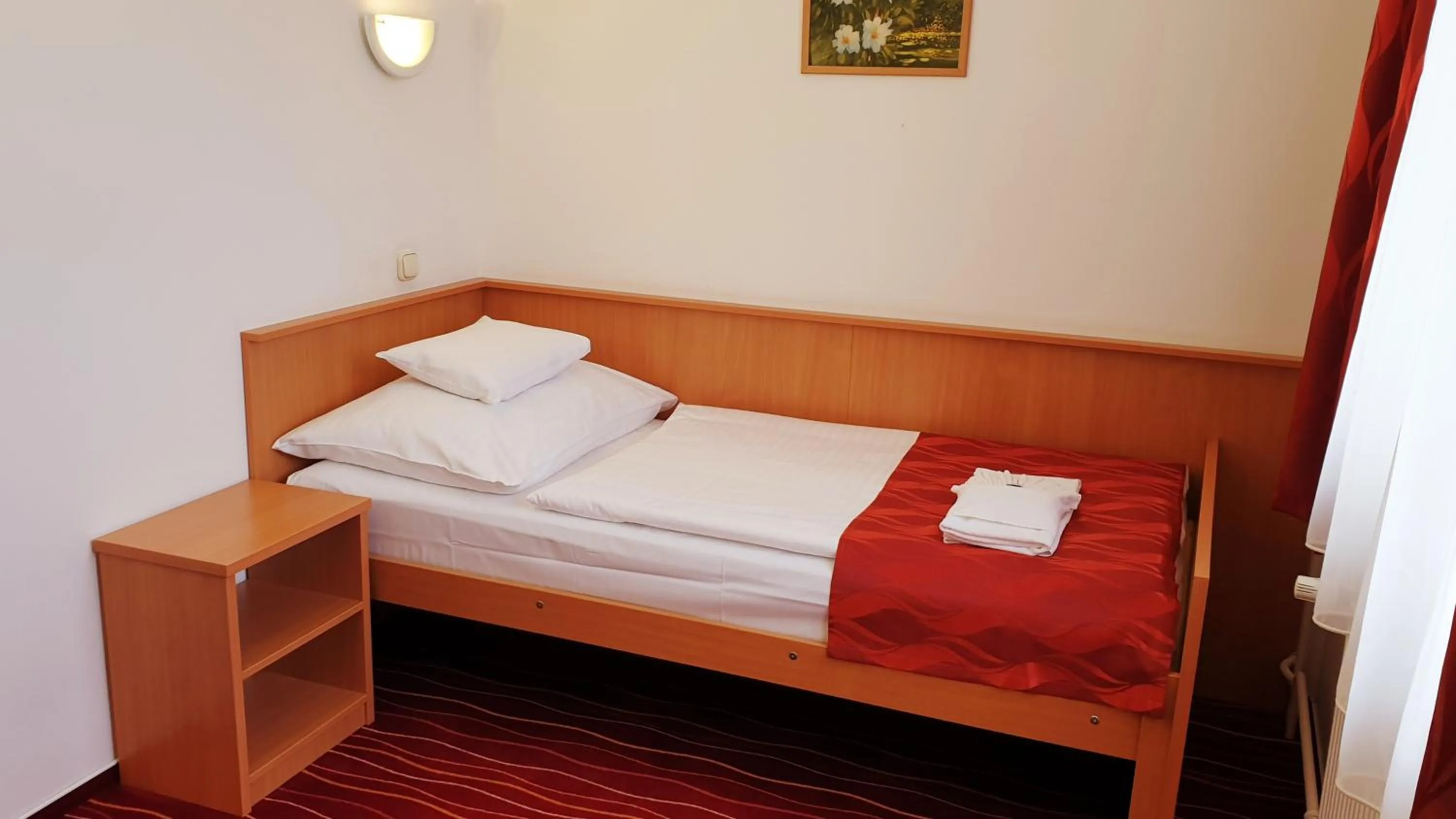 Bed in Diana Club Hotel