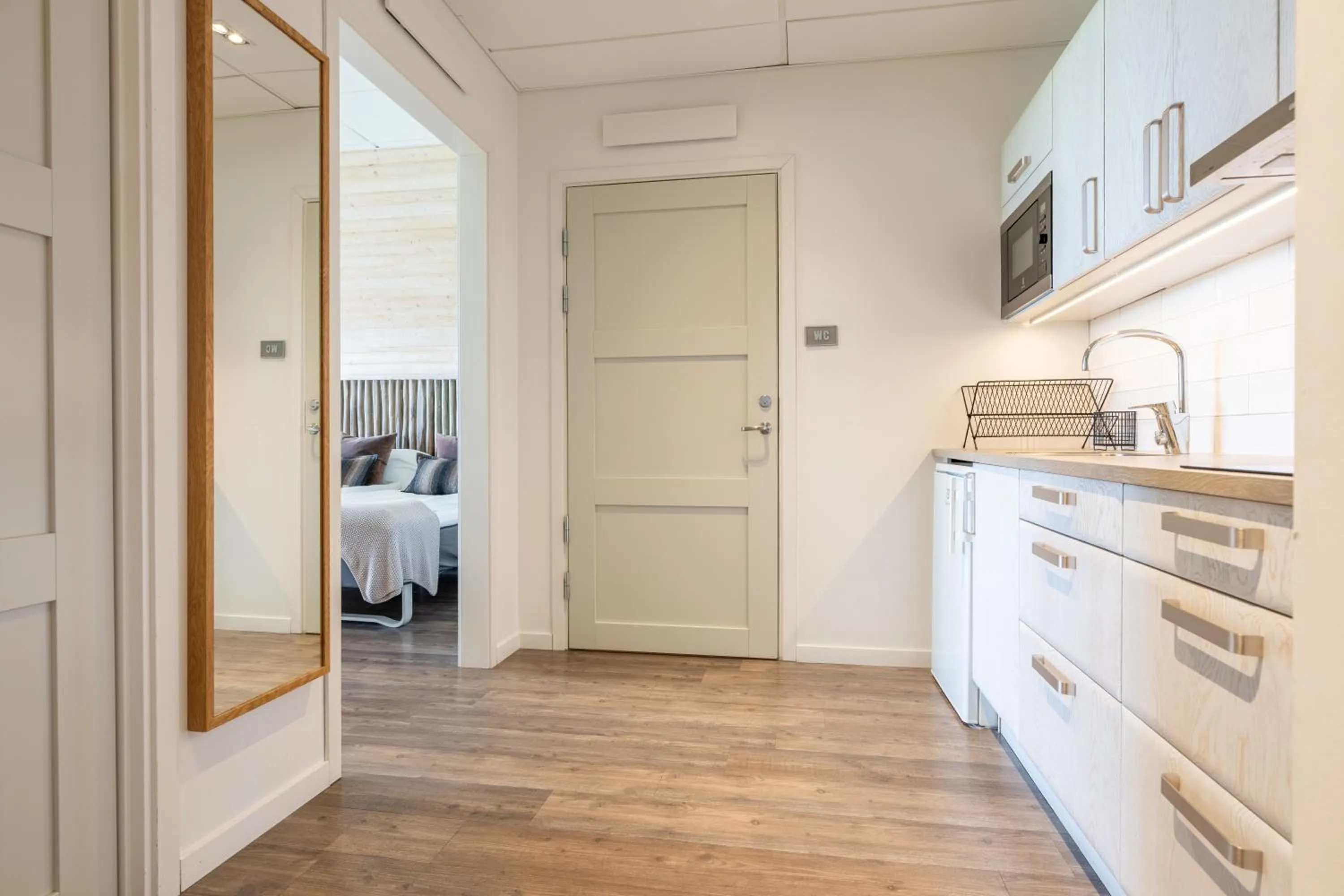 Kitchen or kitchenette, Bed in Halmstad Golfarena Hotell & Lägenheter