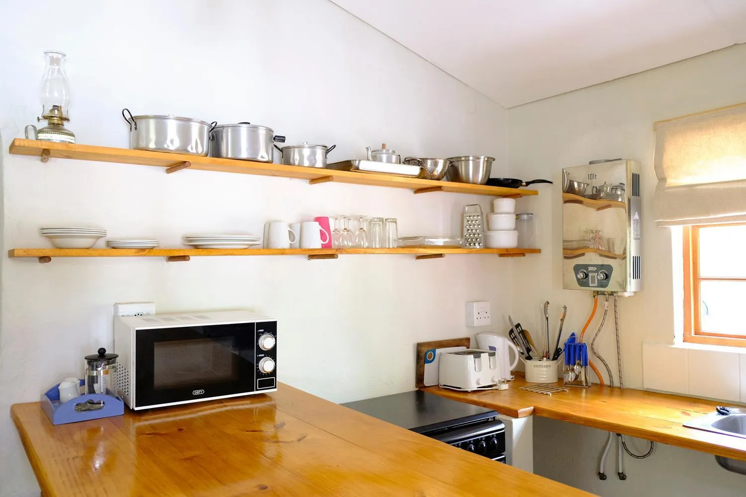 Kitchen or kitchenette in De Bos Cottages