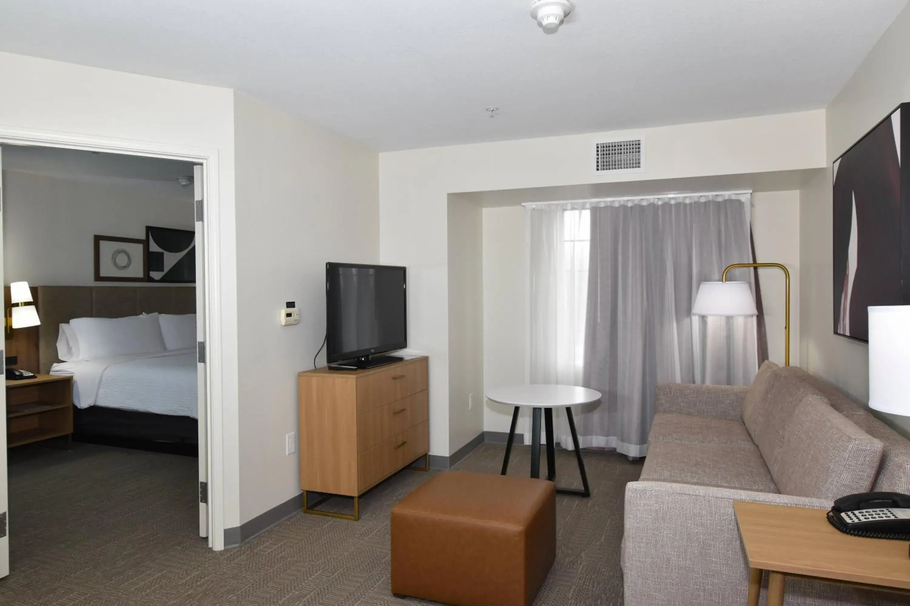 Living room, Bed in Staybridge Suites Detroit-Novi by IHG Living room, Bed in Staybridge Suites Detroit-Novi by IHG