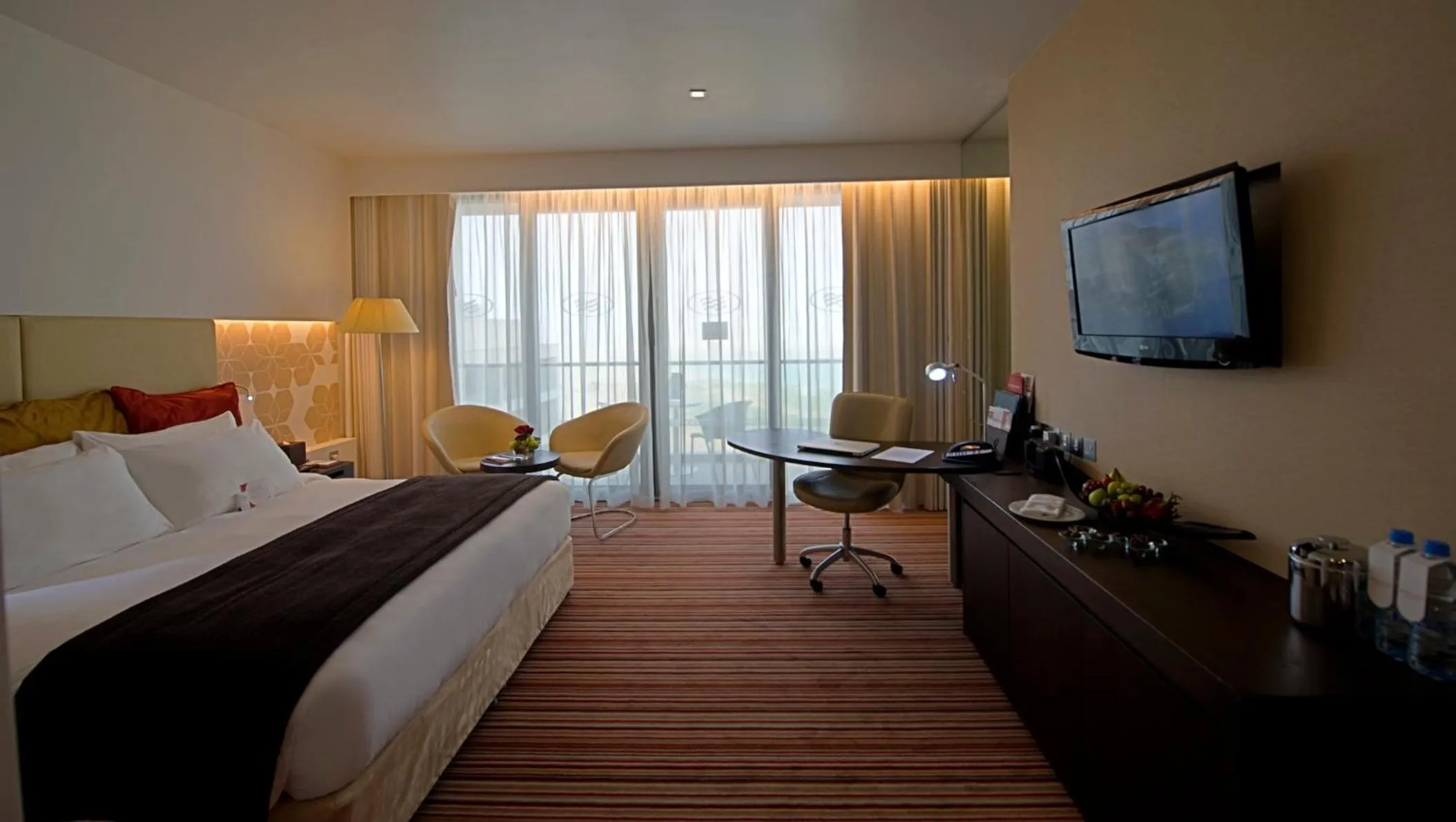 Photo of the whole room, Bed in Crowne Plaza Yas Island by IHG