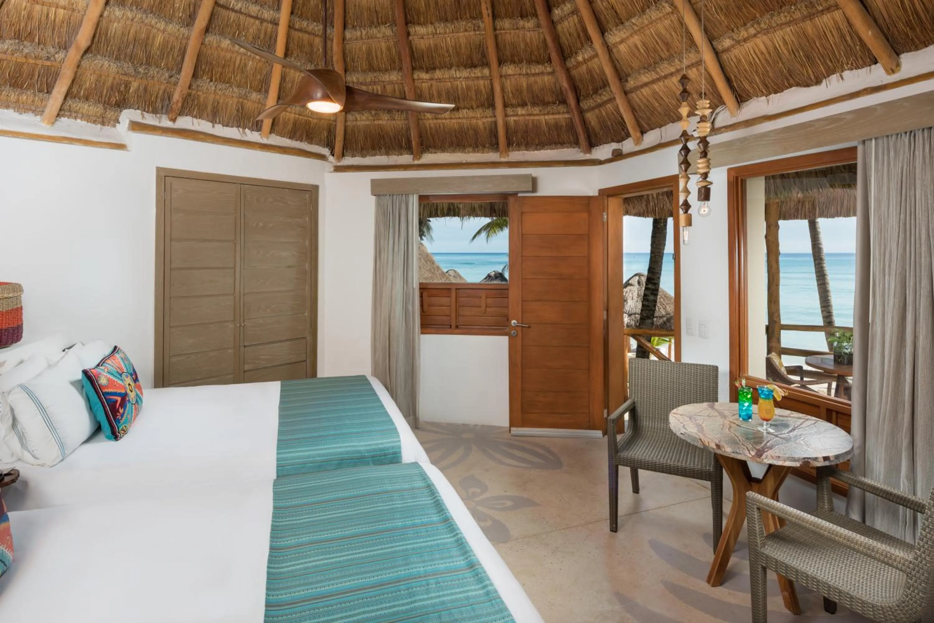 Bed in Mahekal Beach Front Resort & Spa