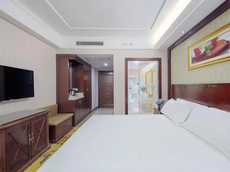 Bed in Vienna Hotel Guilin Lingchuan Shunxiang No.1 Mansion
