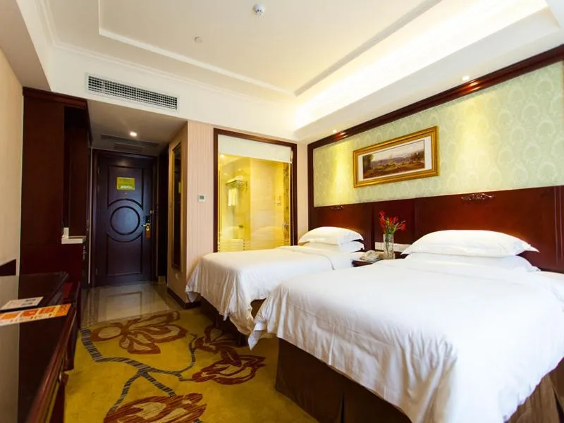 Bed in Vienna Hotel Guangzhou Jinshazhou