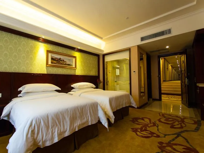 Bed in Vienna Hotel Guangzhou Jinshazhou