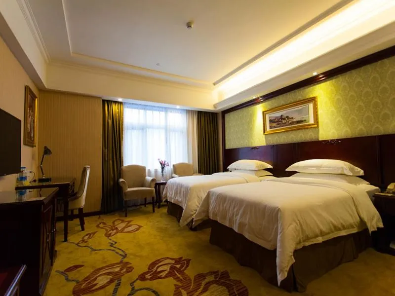 Bed in Vienna Hotel Guangzhou Jinshazhou