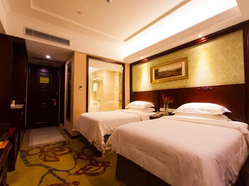 Bed in Vienna Hotel Guangzhou Jinshazhou