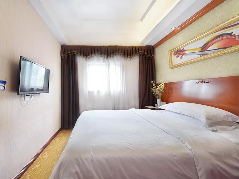 Bed in Vienna Hotel Guangzhou Tonghe