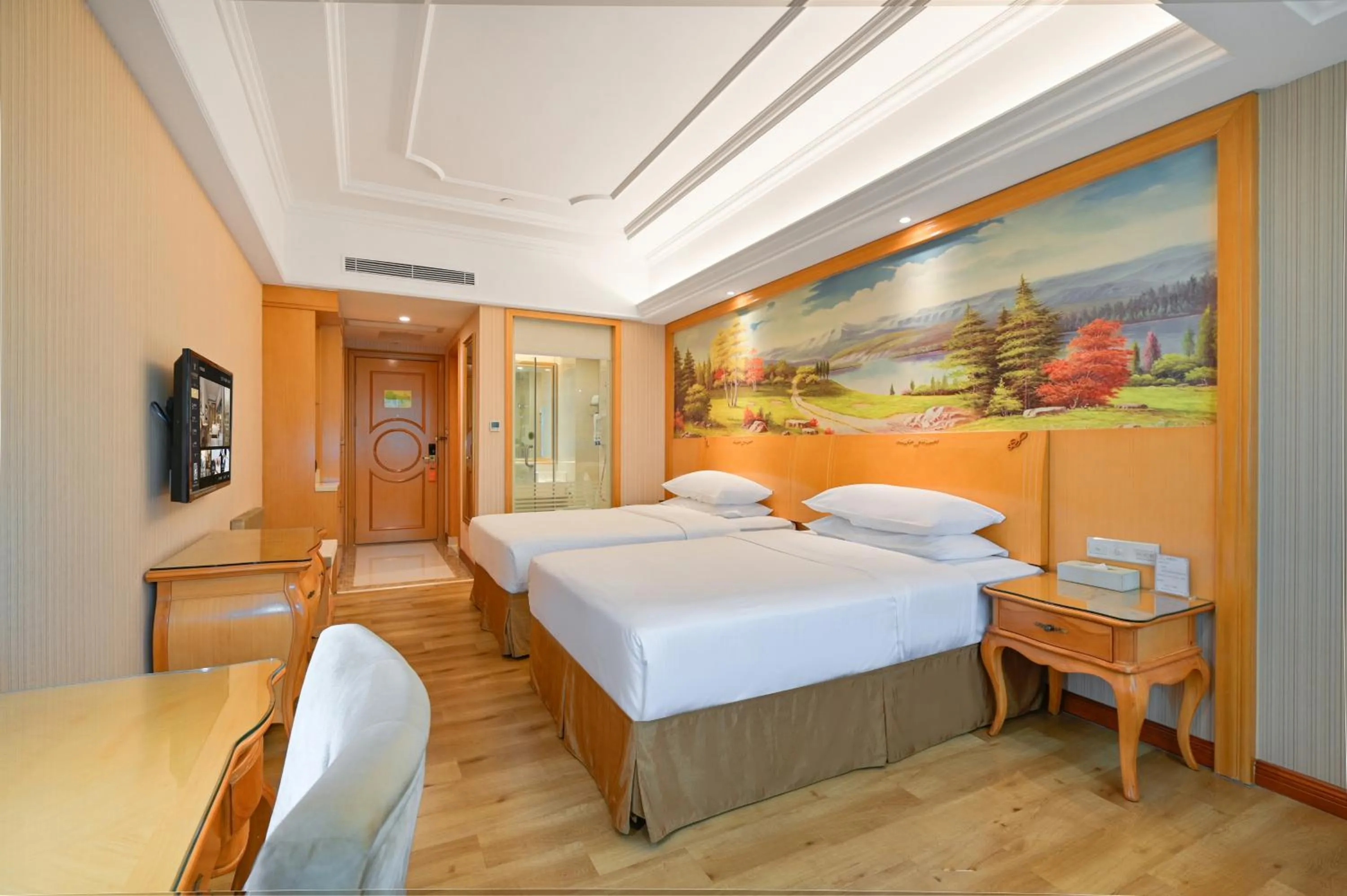 Bed in Vienna International Hotel Guangzhou Baiyun International Conference Center