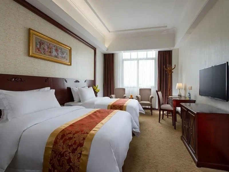 Bed in Vienna Hotel Shanwei Lufeng Jieshi Bus Station