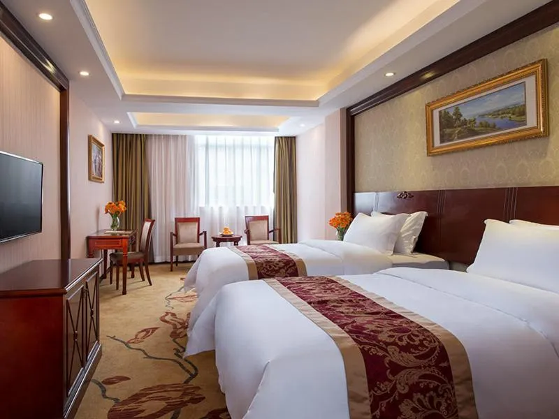 Bed in Vienna Hotel Shenzhen Guanlan Tangren Street