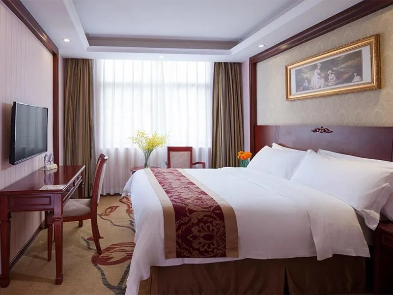 Bed in Vienna Hotel Shenzhen Guanlan Tangren Street