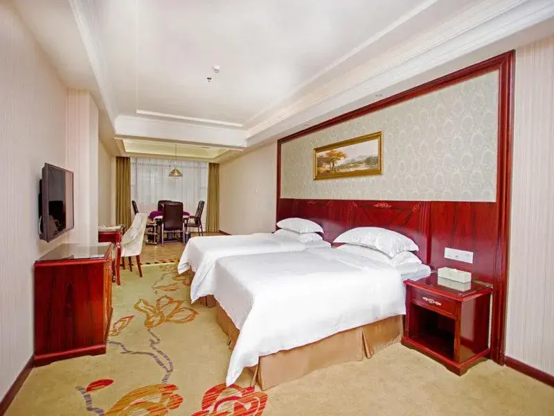 Bed in Vienna Hotel Shenzhen Shiyan Shilong Community Bed in Vienna Hotel Shenzhen Shiyan Shilong Community