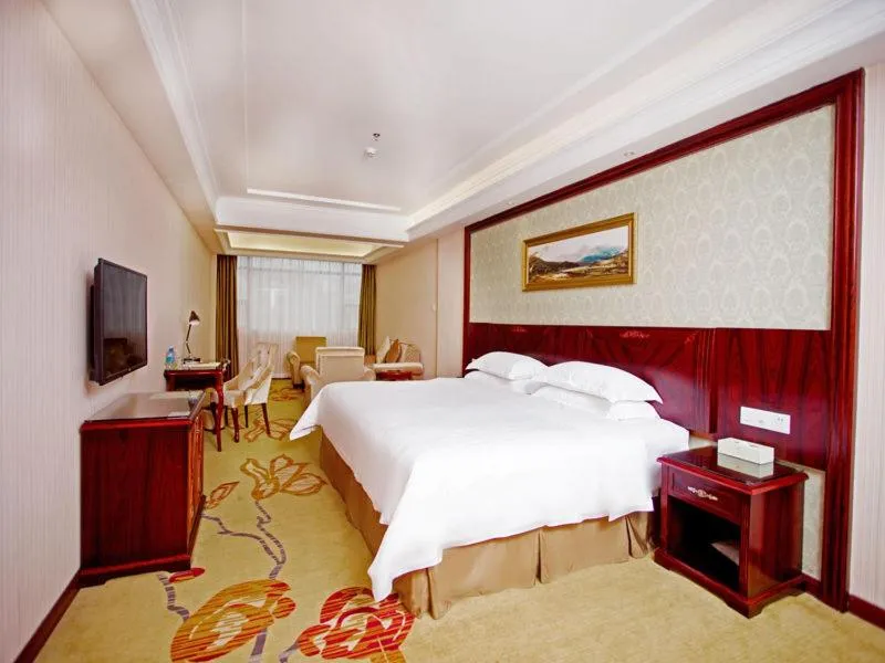 Bed in Vienna Hotel Shenzhen Shiyan Shilong Community
