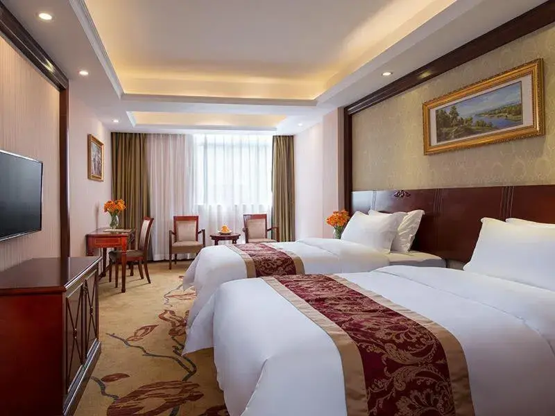 Bed in Vienna Hotel Shenzhen Shiyan Shilong Community Bed in Vienna Hotel Shenzhen Shiyan Shilong Community