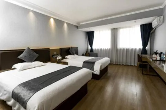 Bed in GreenTree Inn Jiangsu Suzhou Changshu Fuchunjiang International Qipeicheng Road Express Hotel
