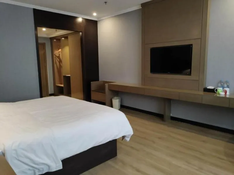 Bed in GreenTree Inn Jiangsu Suzhou Changshu Fuchunjiang International Qipeicheng Road Express Hotel