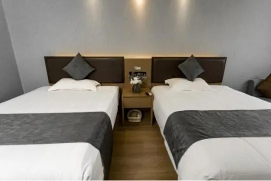 Bed in GreenTree Inn Jiangsu Suzhou Changshu Fuchunjiang International Qipeicheng Road Express Hotel