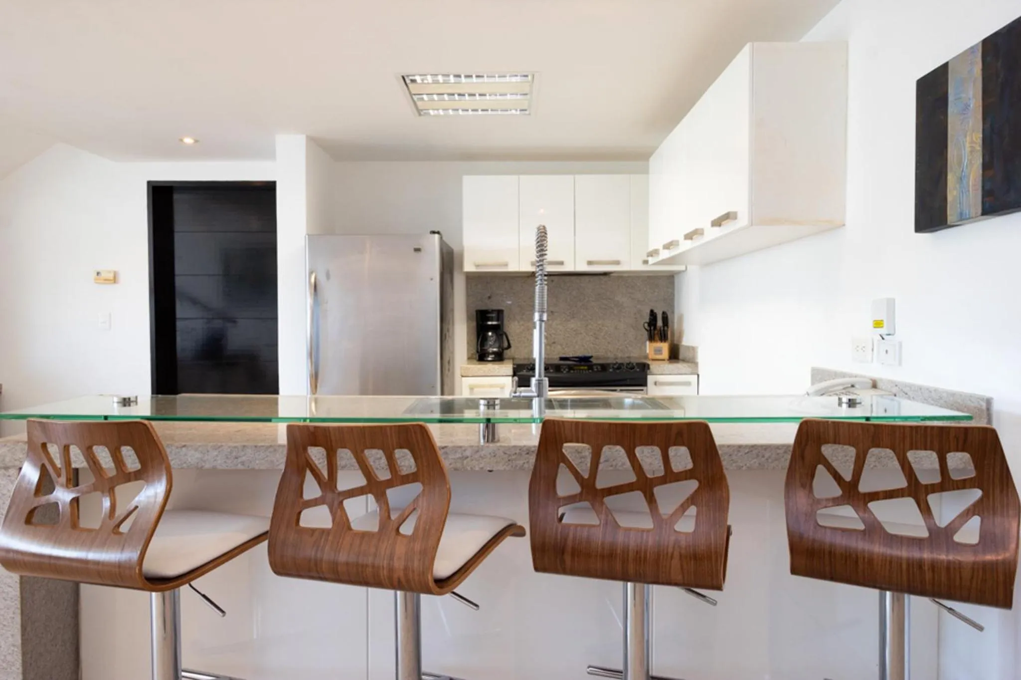 kitchen in The Elements Oceanfront & Beachside Condo Hotel