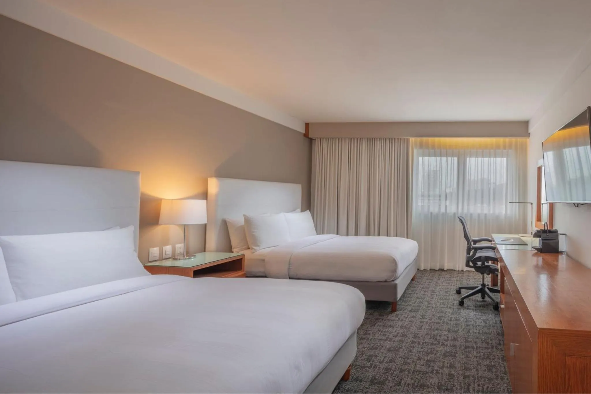 Photo of the whole room, Bed in Presidente InterContinental Puebla by IHG