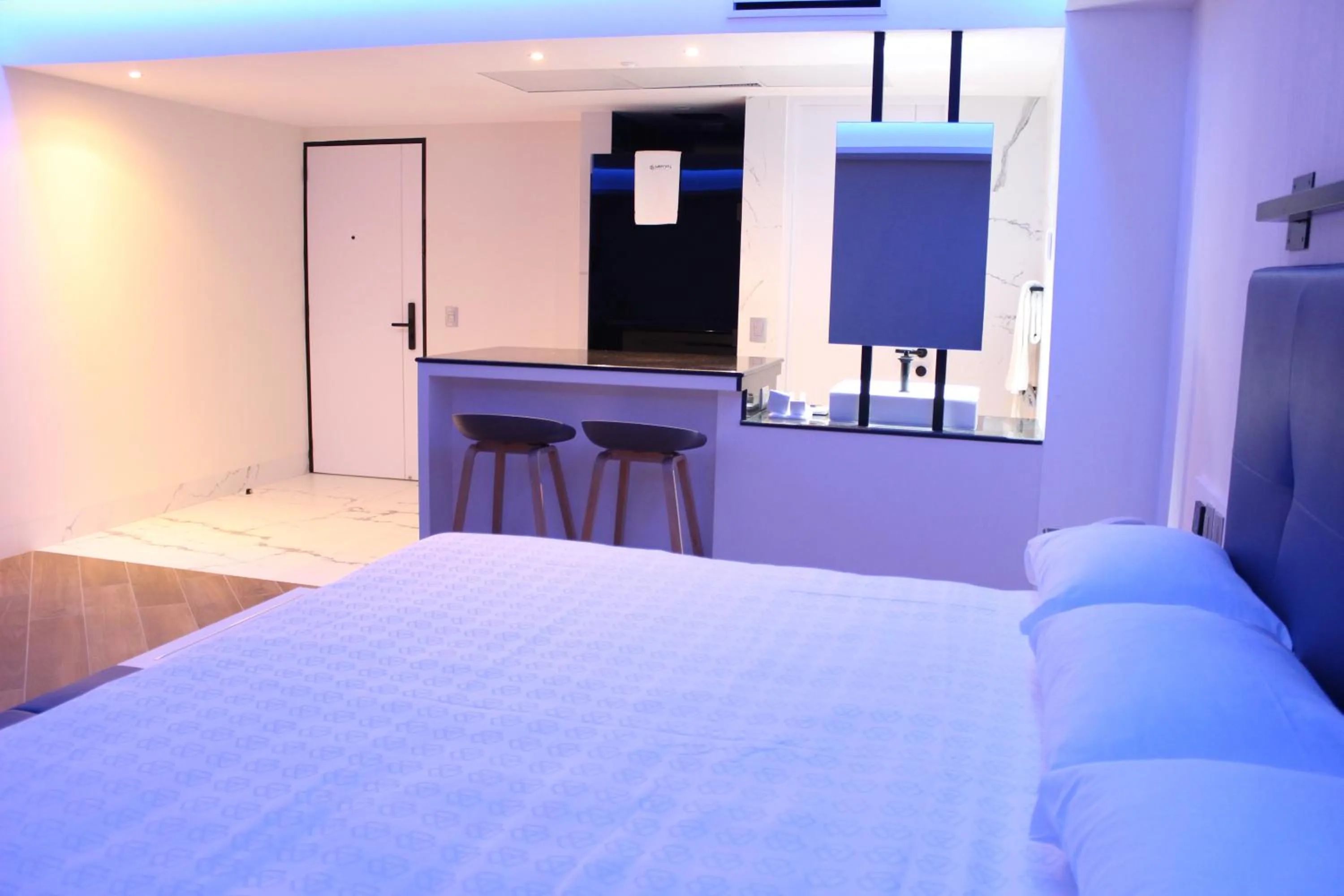 Bedroom, Bed in WeEnjoy Hotels Grand Prix Aeropuerto CDMX