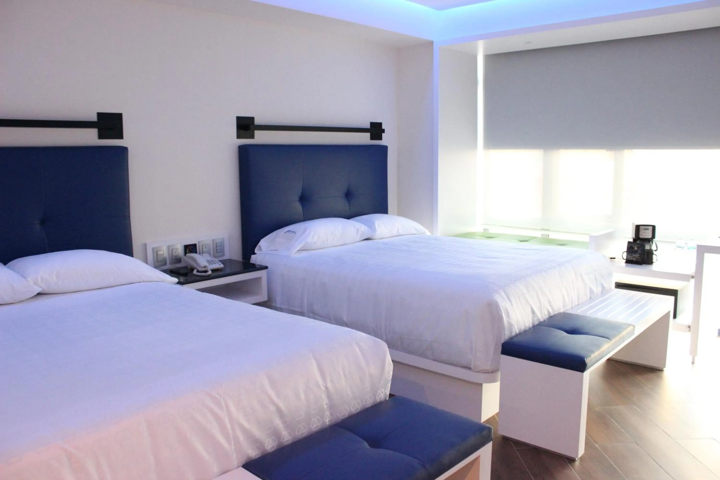 Bed in WeEnjoy Hotels Grand Prix Aeropuerto CDMX