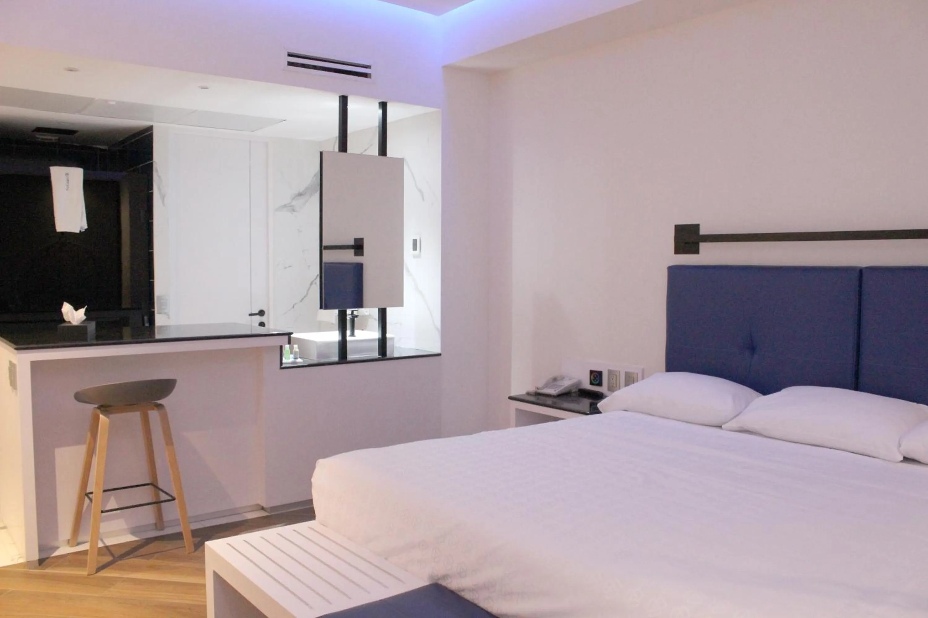 Bedroom, Bed in WeEnjoy Hotels Grand Prix Aeropuerto CDMX