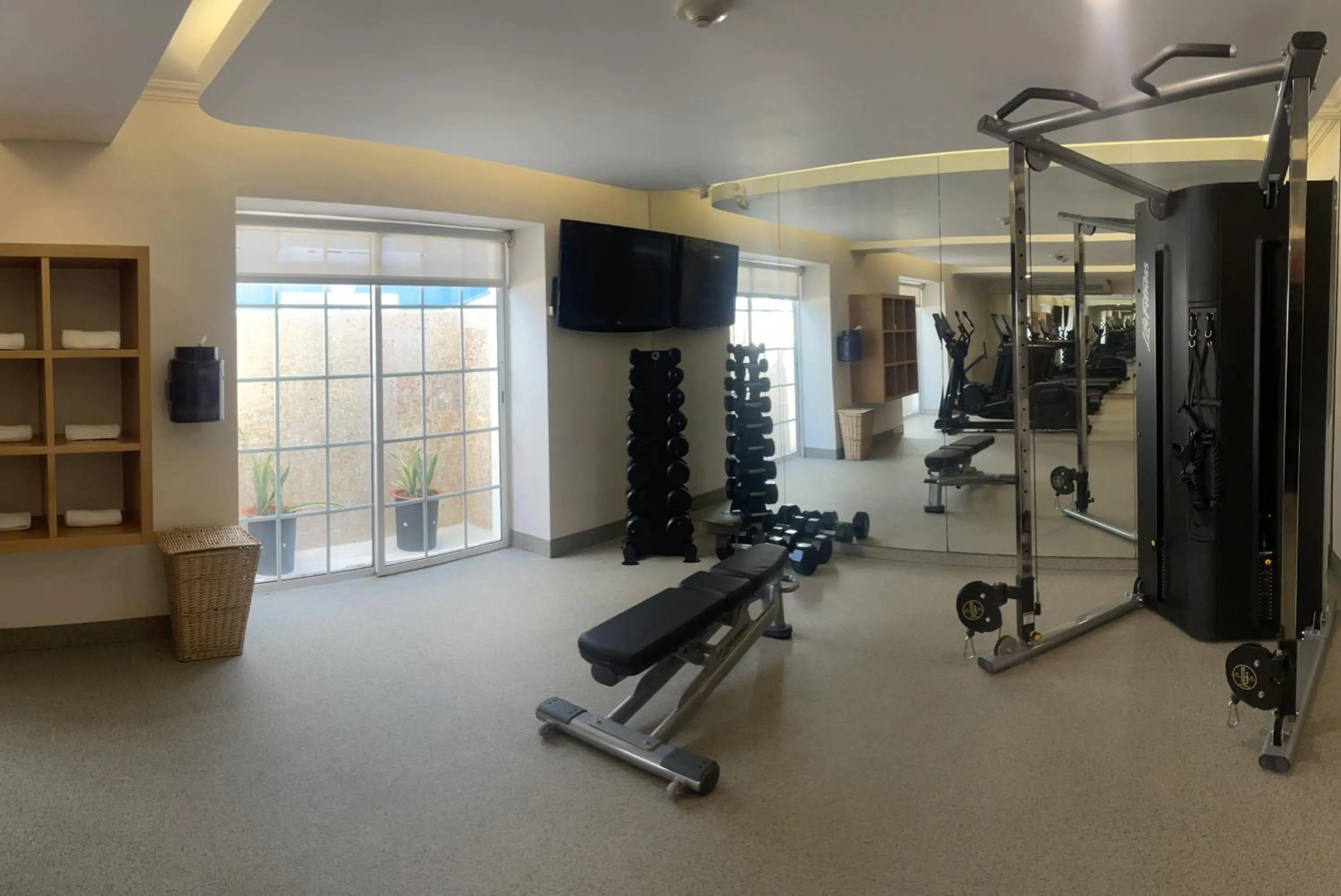 Fitness centre/facilities in Villa Mercedes Curio Collection By Hilton