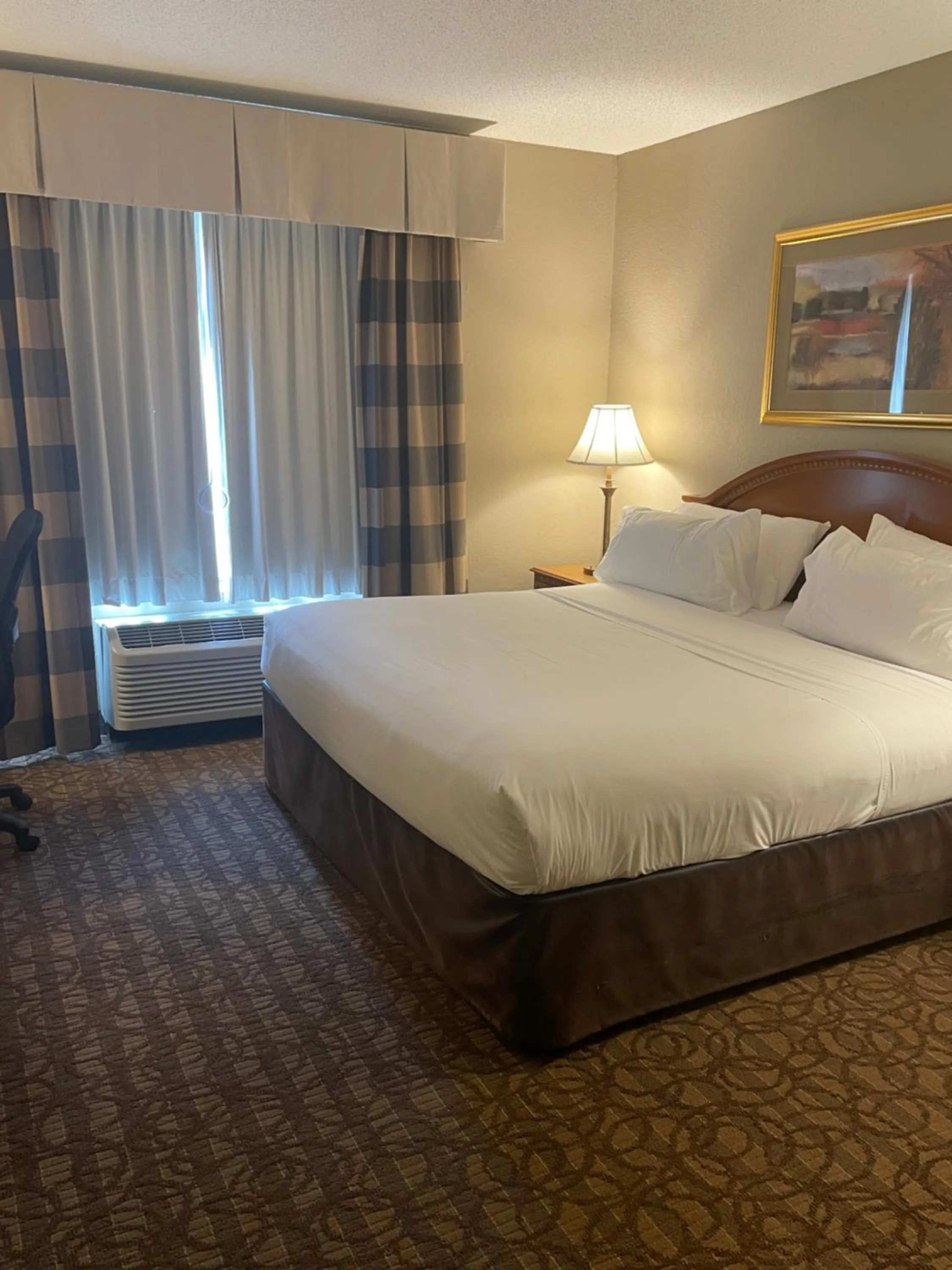 Bed in Stay Suites formerly known as Days Inn & Suites by Wyndham La Crosse-Onalaska