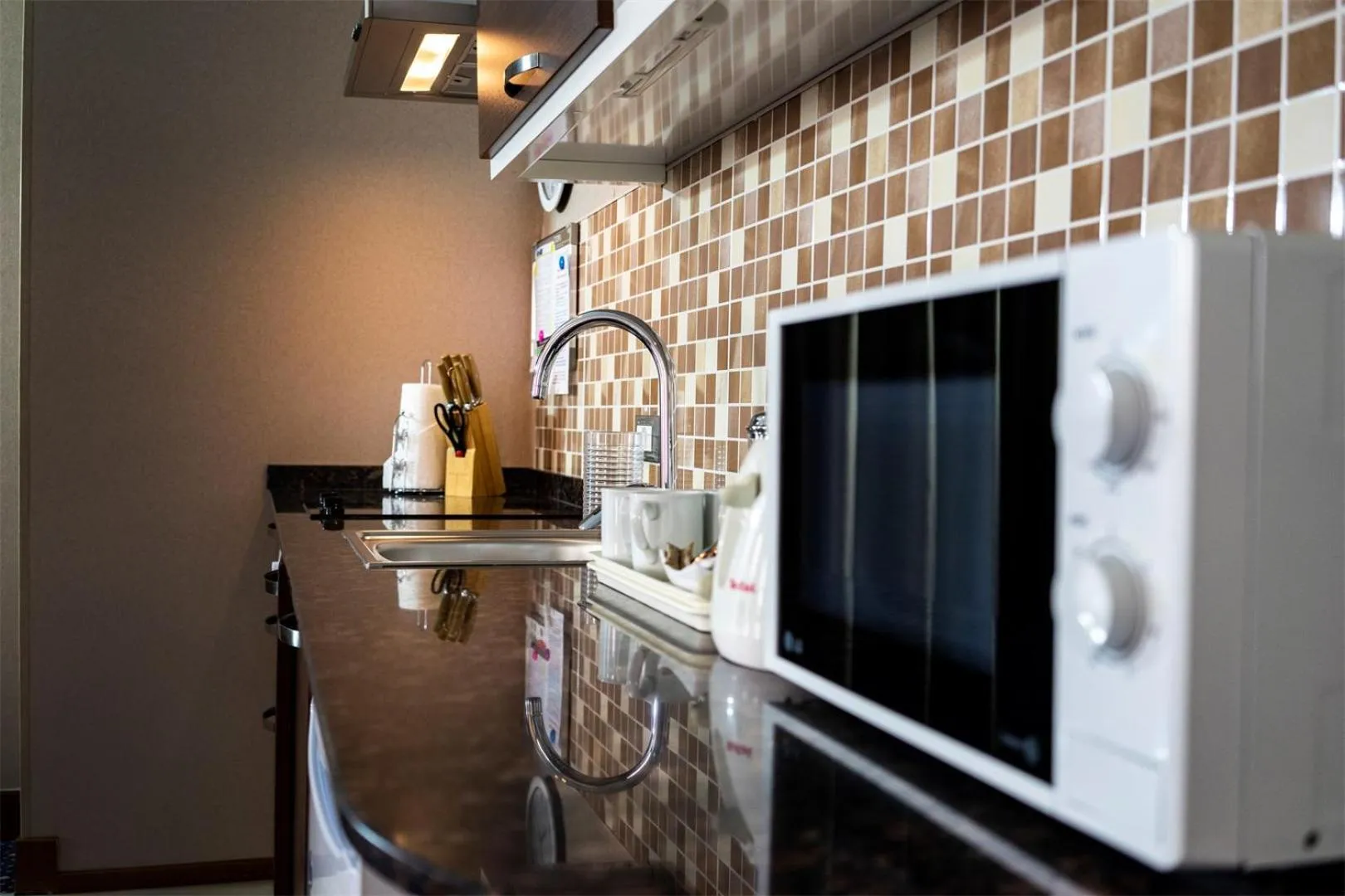 Kitchen or kitchenette in Parkside Hotel & Apartments