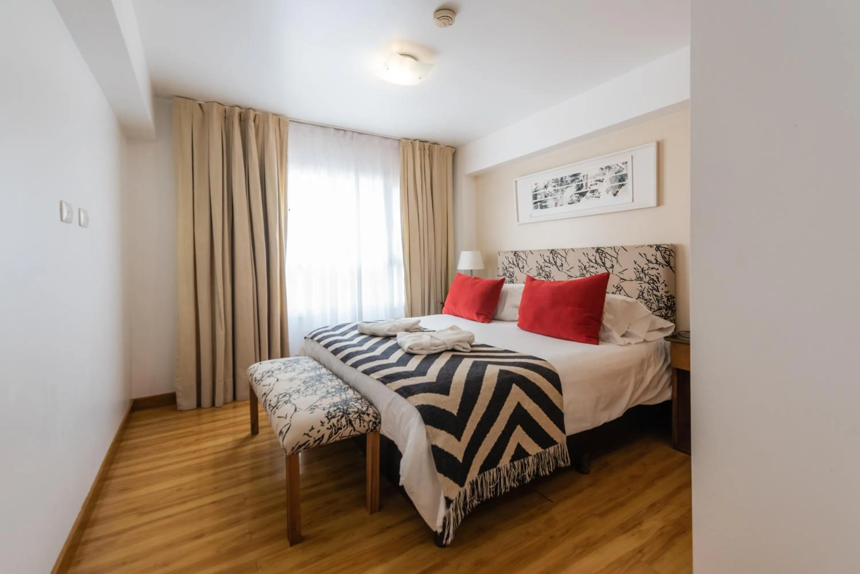 Bed in Cilene del Faro Suites & Spa