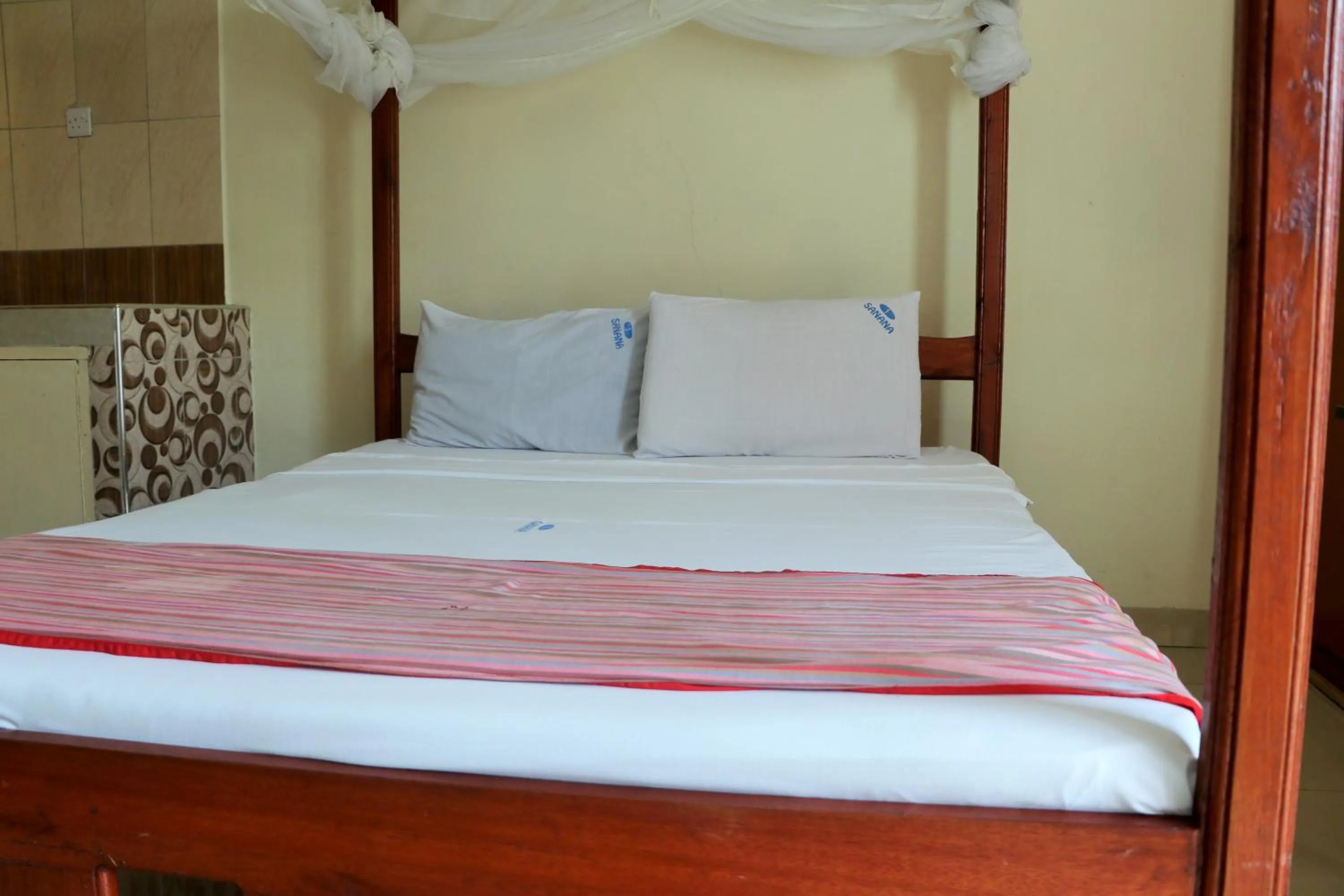 Bed in Sanana Conference Center and Holiday Resort