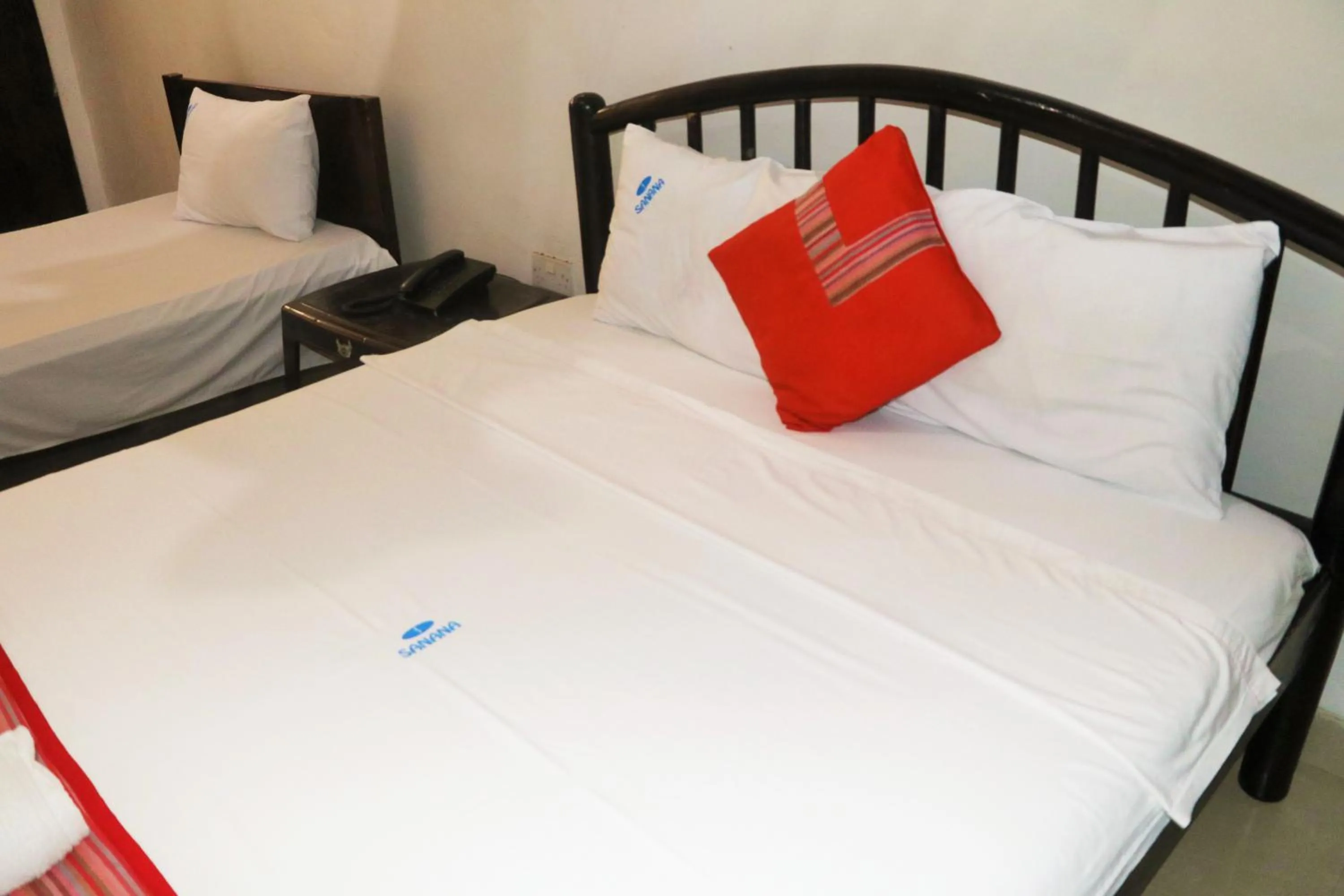 Bed in Sanana Conference Center and Holiday Resort