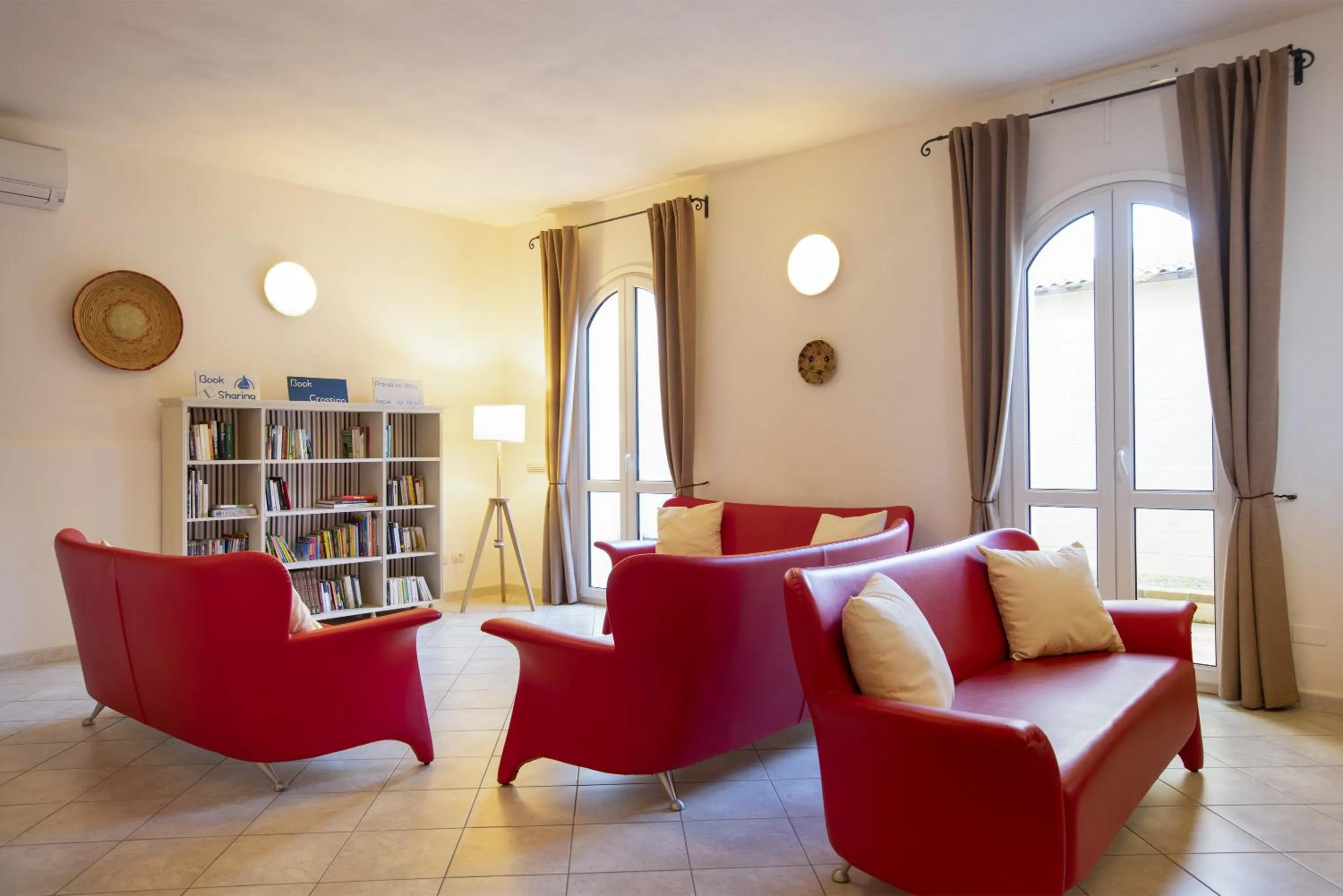 Communal lounge/ TV room in MuMA Hostel