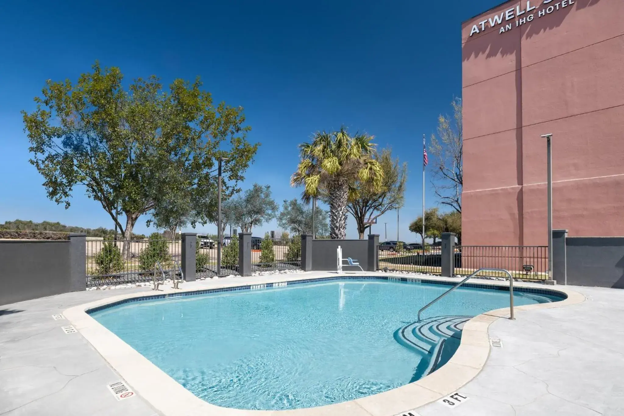 Swimming pool in Atwell Suites Austin Airport by IHG Swimming pool in Atwell Suites Austin Airport by IHG