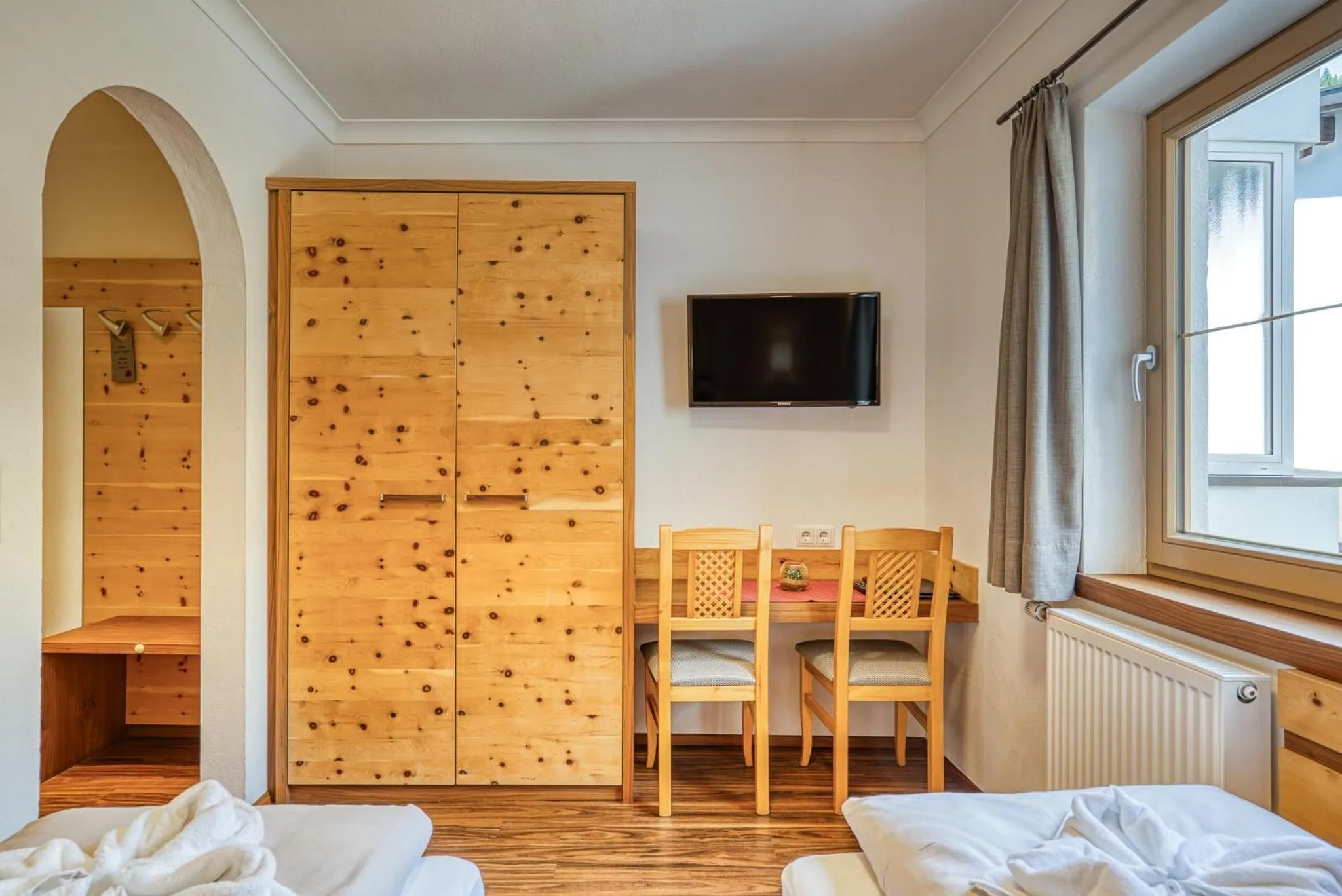 Photo of the whole room, Bed in SonnenHOF hotel gerlos centrum