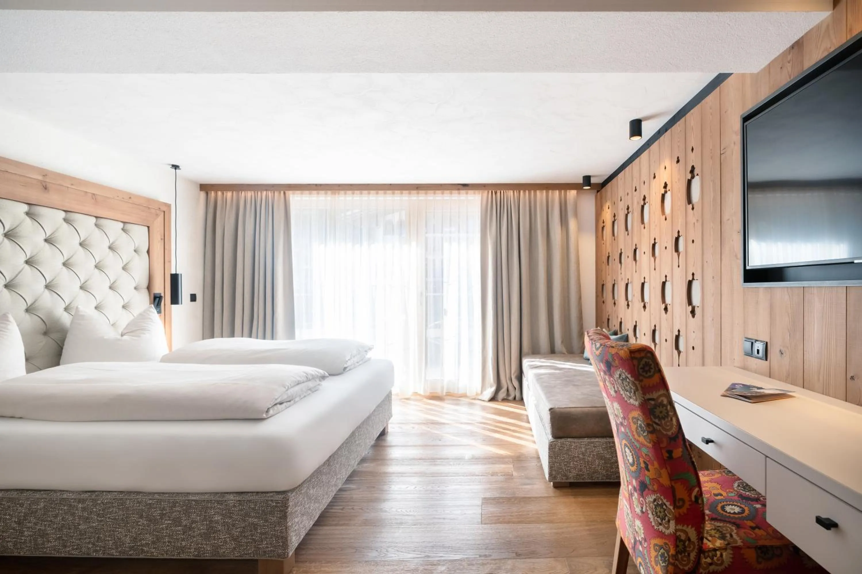 Photo of the whole room, Bed in SonnenHOF hotel gerlos centrum