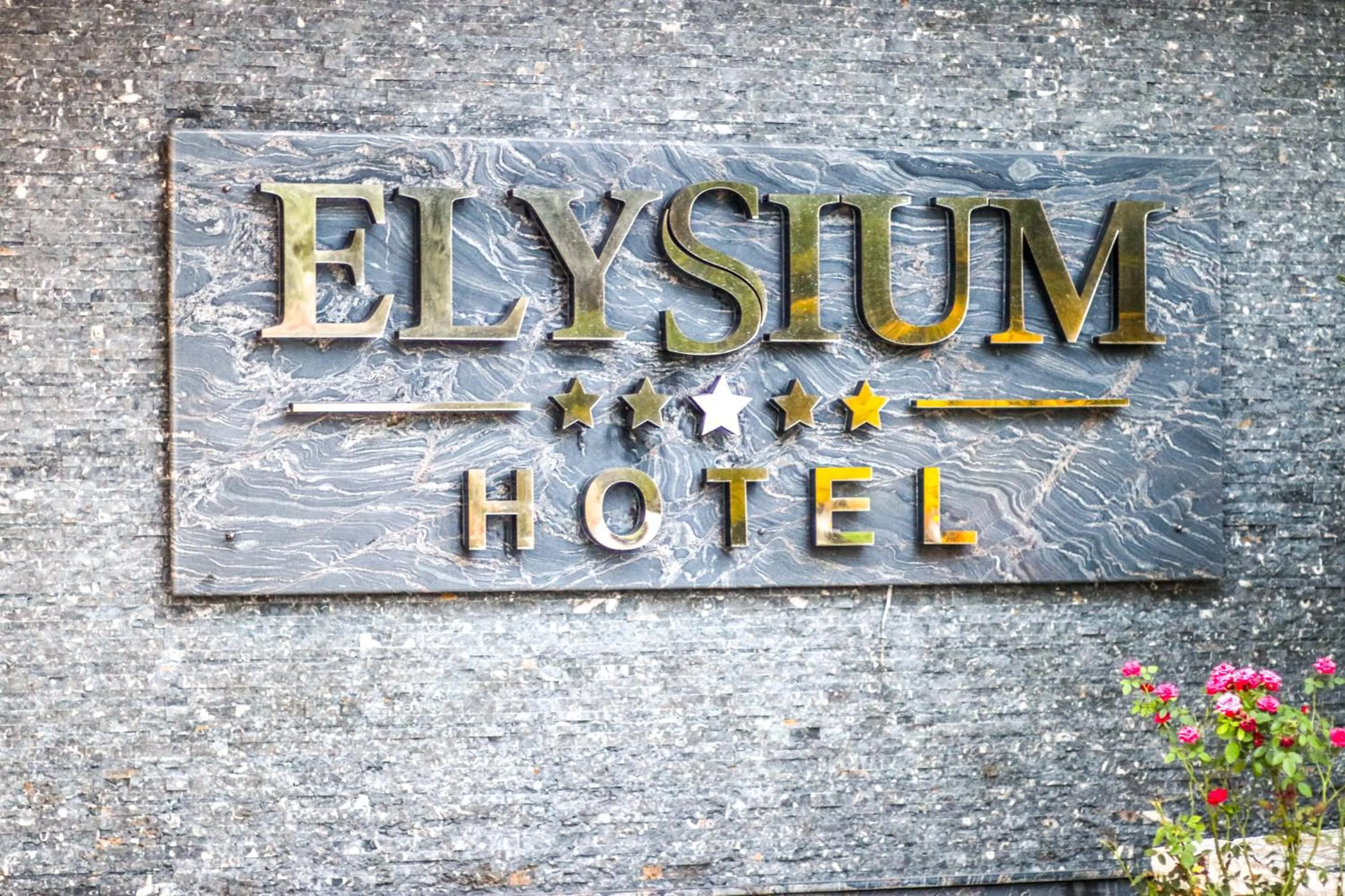 Property logo or sign in Elysium Hotel