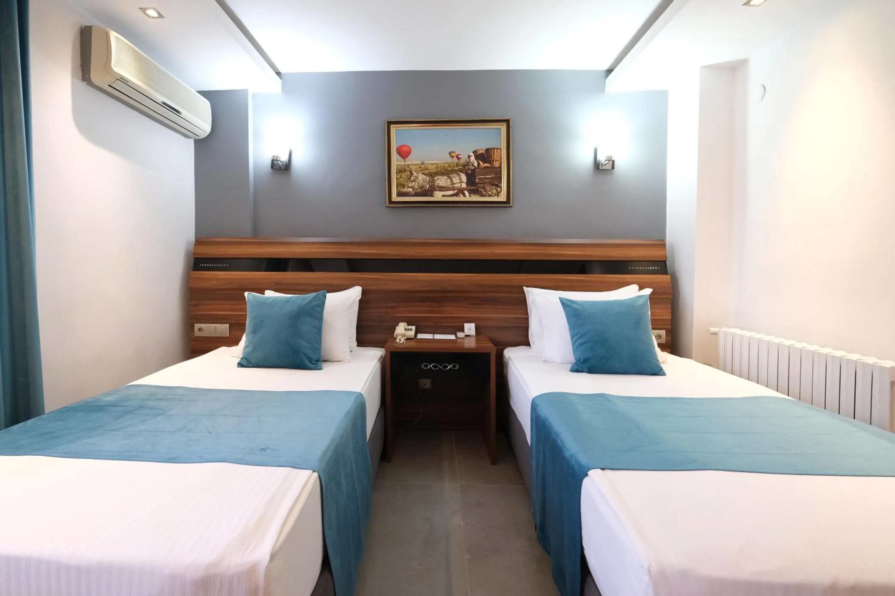 Bed in SIGNATURE GARDEN AVANOS Hotel & SPA